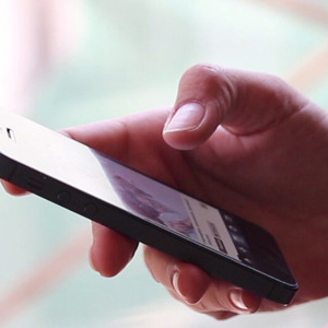 Women Using Touch Screen Smartphone-590x300