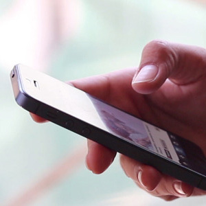 Women Using Touch Screen Smartphone-590x300