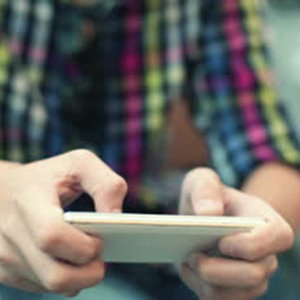 stock-footage-young-teenager-playing-game-on-smartphone