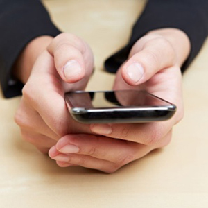 womans_hands_operating_smartphon_450