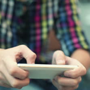 stock-footage-young-teenager-playing-game-on-smartphone