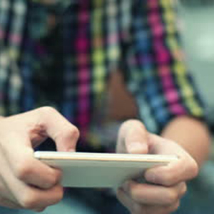 stock-footage-young-teenager-playing-game-on-smartphone